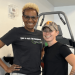 Joy Buckley Reed Smiling in a Gym.