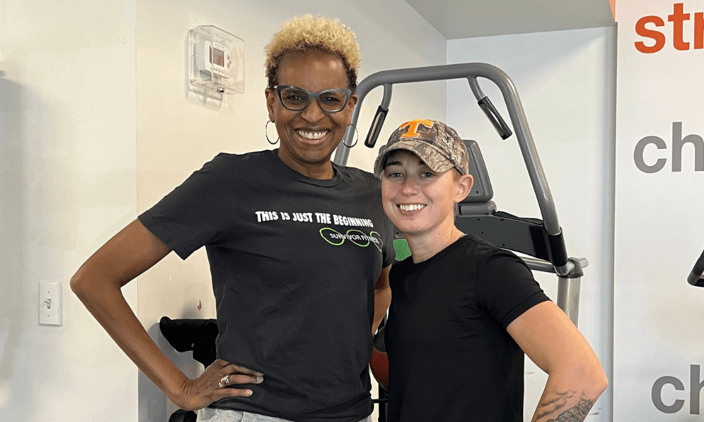 Joy Buckley Reed Smiling in a Gym.