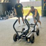 cancer survivor working out at gym