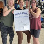 survivor fitness participants holding an I can and I will sign