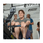 man using rowing machine at gym