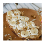 sliced bananas, peanut butter and coconut on toast